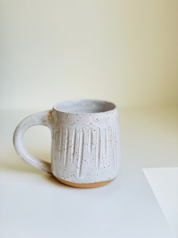 Carved white mug